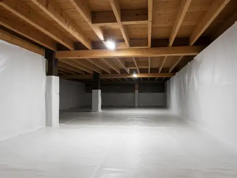 Encapsulated crawl space with white vapor barrier for crawl space repair in Oklahoma City